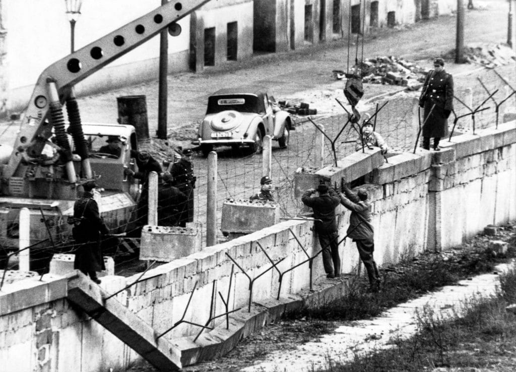 People gathering at the Berlin Wall checkpoint